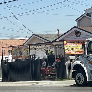 a truck parked in front of a restaurant