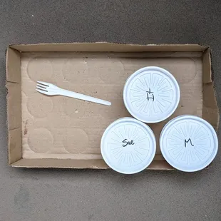 Love that they re-use liquor store cardboard for takeout, sustainable and humble