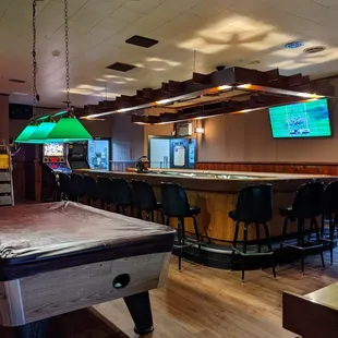 a pool table and bar