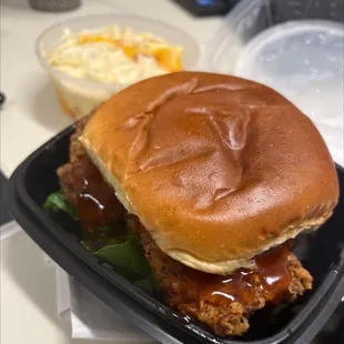 Hot Honey Chicken with a side of Mac and Cheese in the background