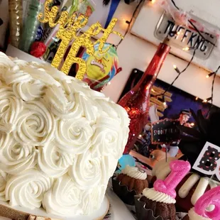 a cake with white frosting on a table