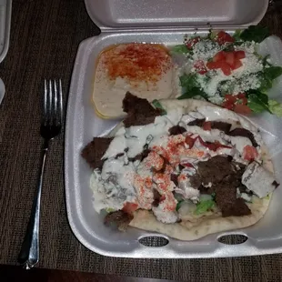 a tray of food and a fork