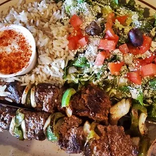 Beef kabob plate with rice and greek salad