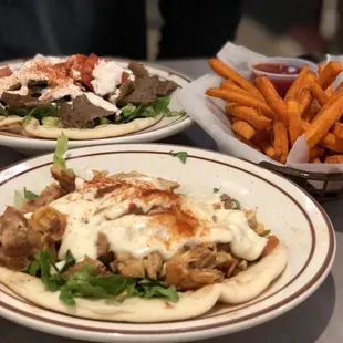 Potato fries, gyro, and grilled chicken wrap