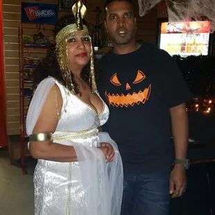 a man and a woman dressed in costumes