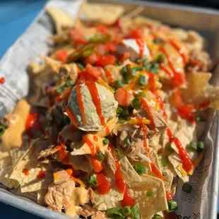 a tray of nachos on a table