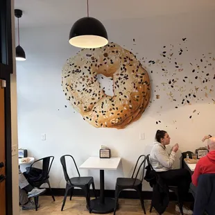 Inside with cool bagel art on a wall -- on Saturday morning, 21 December 2024