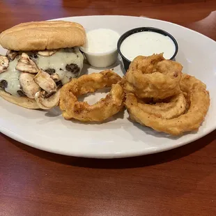 Mushroom and Swiss burger with onion rings