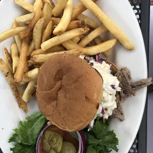 Pulled pork sandwich with coleslaw and fries