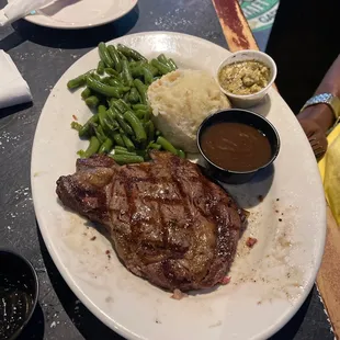 12oz Ribeye steak well done with potatoes, gravy and string beans