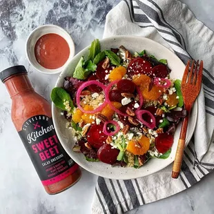 a bowl of beet salad with a bottle of ketchup