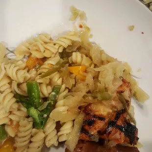 a plate of pasta with meat and vegetables