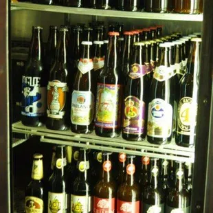 a refrigerator full of beer bottles