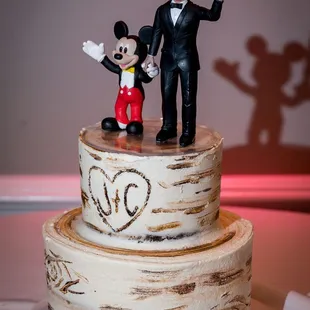 Mickey Mouse and Phil Collins cake topper