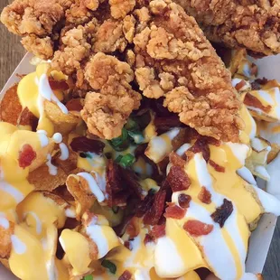 Loaded Baked Potato Twisted Fries w/ a Chicken Fingers to top it off!