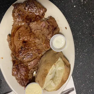 a plate of steak and potatoes