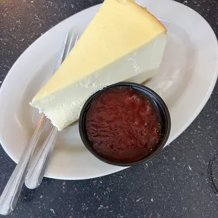 Cheesecake with strawberry sauce on the side