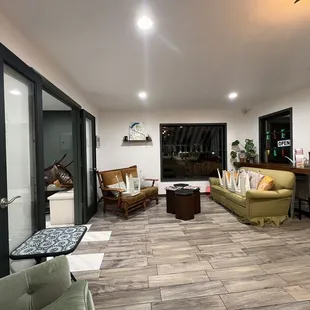 a living room with wood flooring