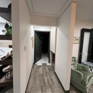a hallway with a couch and a table