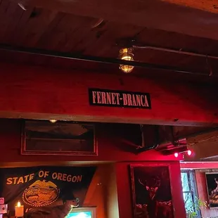 Fernet Branca street sign and Rainier beer memorabilia