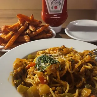 Sausage and peppers on pasta - so delicious!!! I also have some sweet potato fries. The ketchup not needed (my vice).