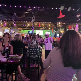 a crowd of people sitting at tables