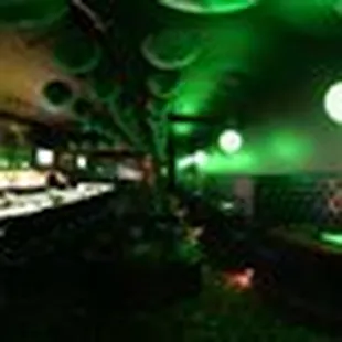 a bar with green lights