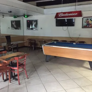 Private section with a pool table