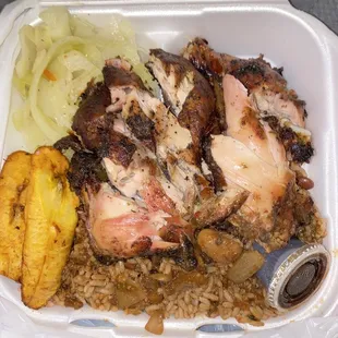 Jerk Chicken Meal (large) with rice and peas, cabbage, and plantains. Reallly good with extra gravy