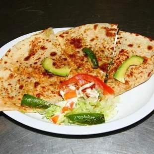Quesadillas with Avocado toppings.