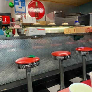 Counter stools across from Booths