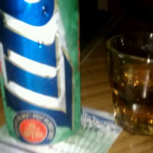 a can of mountain dew next to a glass of soda