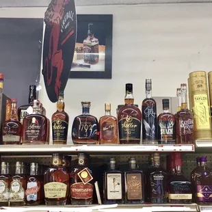 a shelf of liquor bottles