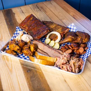 a platter of meat and sides