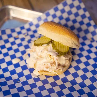 a chicken sandwich with pickles