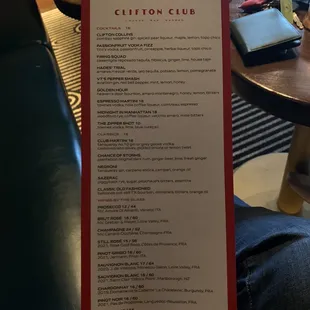 a person holding a menu
