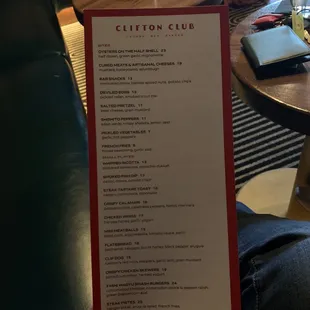 a person holding a menu