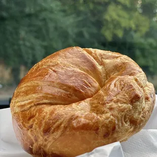 a croissant on a napkin