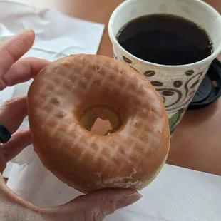 Glazed donut and black coffee