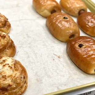 Ham &amp; cheese next to sausage and cheese, the alter with a kick or without