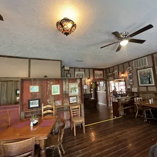 a dining room with a ceiling fan