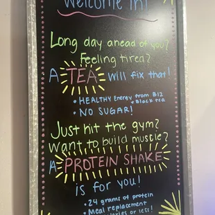 a blackboard with a sign that says welcome in