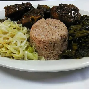 oxtails rice and peas with cabbage and greens