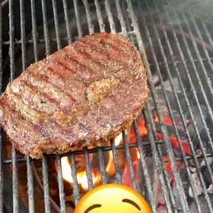 a steak on a grill
