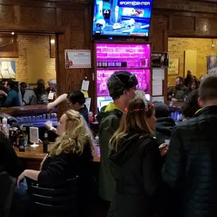 a crowd of people at a bar
