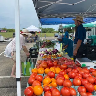 a farmer selling tomatoes