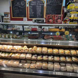 a display of sandwiches and pastries