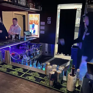 a man and a woman at a bar