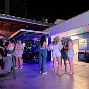 a group of people standing outside at night