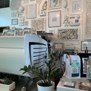 a coffee machine and potted plants